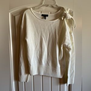 The limited cream sweater in size PXS